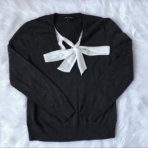 Dark grey sweater with elegant white details